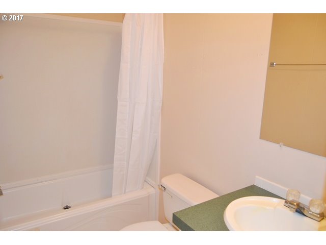 8155 Burbank Road Tillamook, OR 97141 - Photo 11 of 21 a bathroom with a sink and a mirror