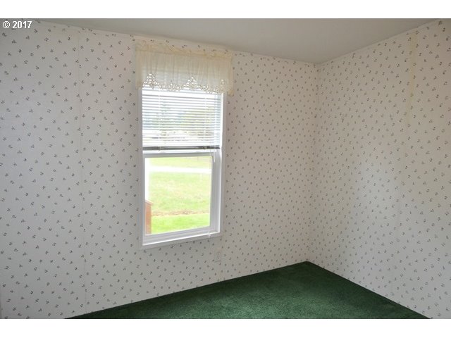 8155 Burbank Road Tillamook, OR 97141 - Photo 12 of 21 a view of an empty room and window