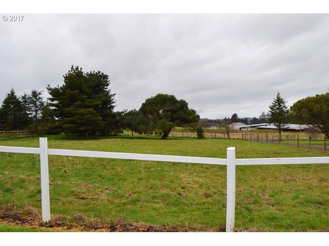 8155 Burbank Road Tillamook, OR 97141 - Photo 17 of 21 a view of an outdoor space and tennis court