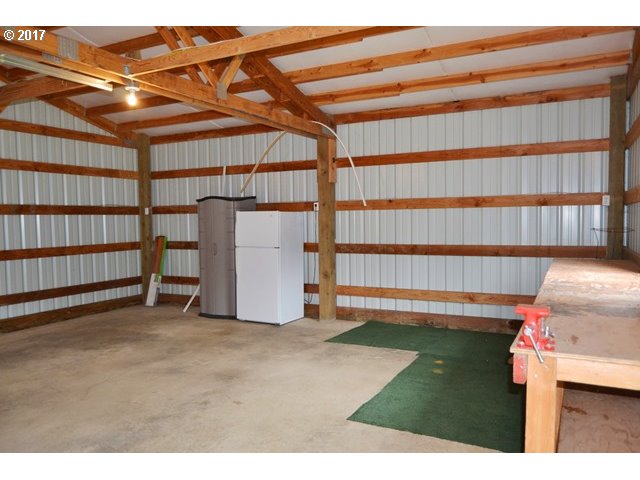 8155 Burbank Road Tillamook, OR 97141 - Photo 20 of 21 a view of a room with racks on the wall