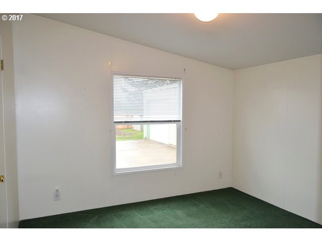 8155 Burbank Road Tillamook, OR 97141 - Photo 9 of 21 an empty room with a window