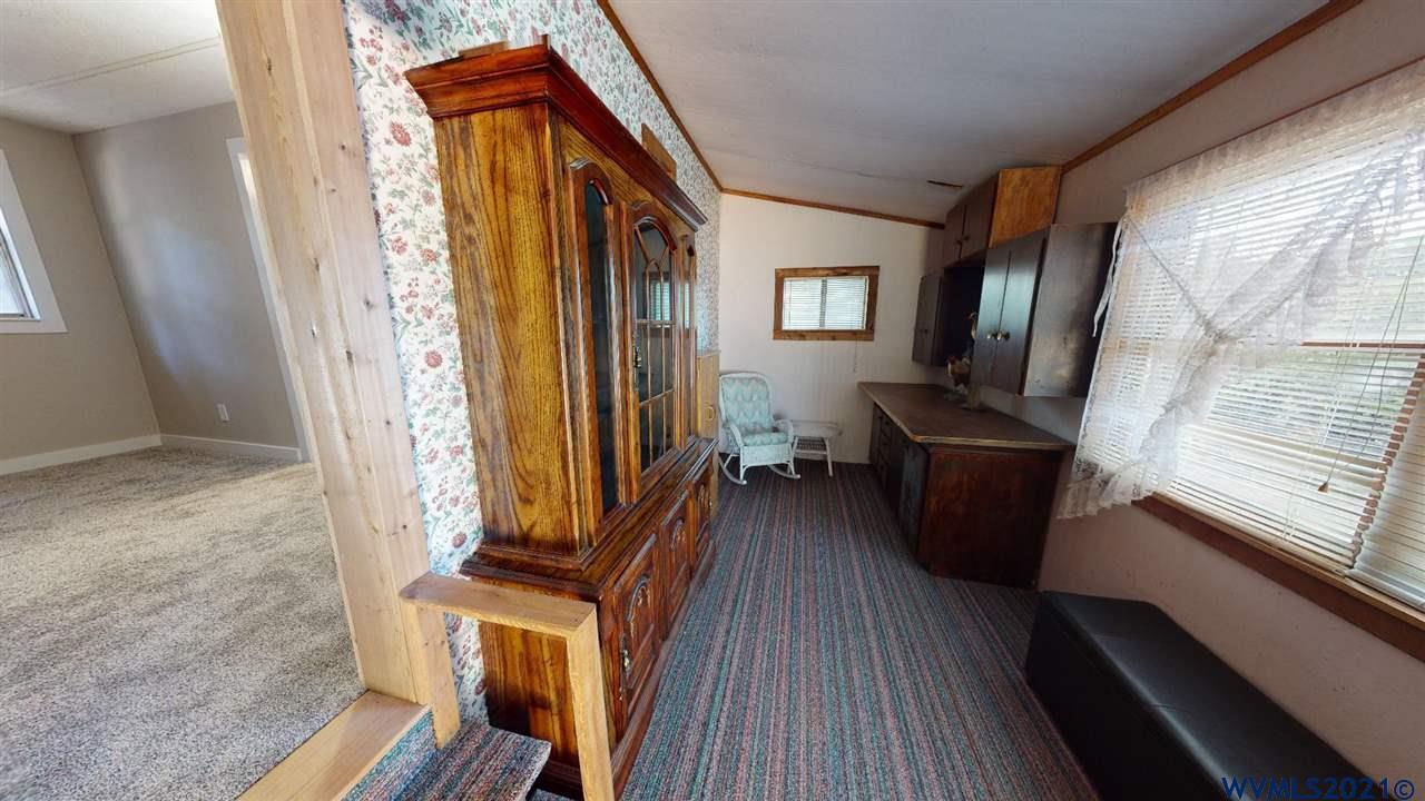 7990 Marion Road Turner, OR 97392 - Photo 10 of 25 a view of a hallway with wooden floor and staircase