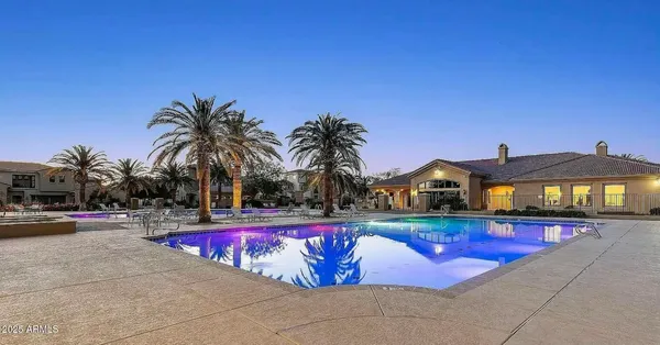 a view of swimming pool with outdoor seating