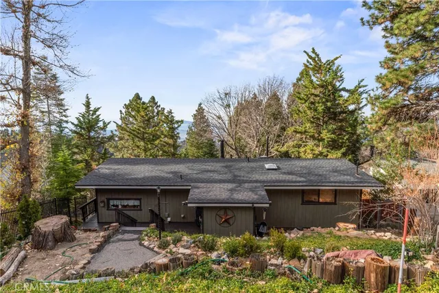 a view of a house with a flower garden
