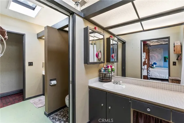 a bathroom with a sink and a mirror