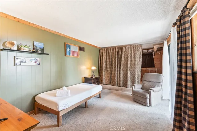 a bedroom with a bed and a closet