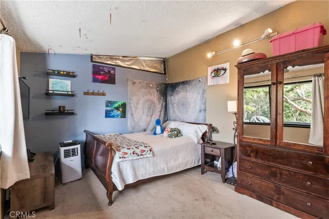 a view of lobby with a couch and wooden floor