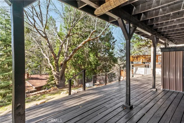 a view of outdoor space with wooden floor and seating