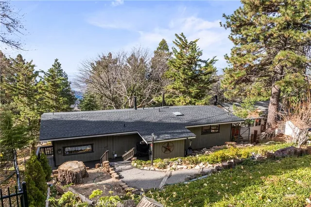a view of house with outdoor space and sitting area
