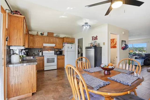 a view of a kitchen and dining area