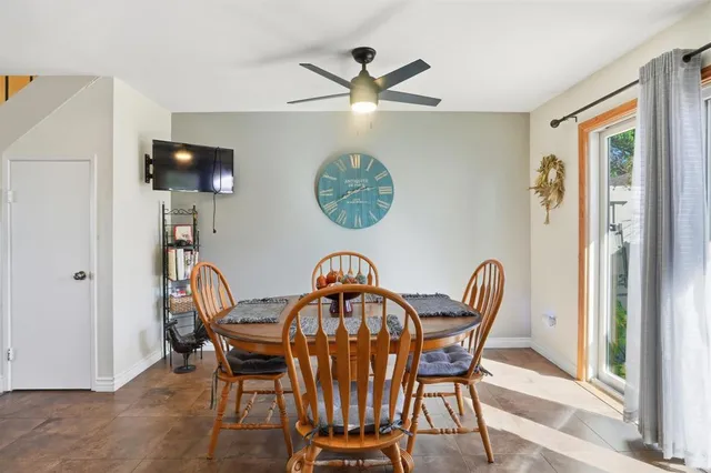 a view of a dining room with furniture and chandelier