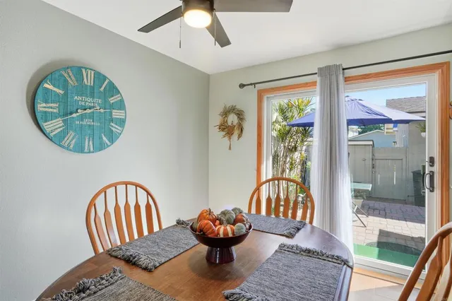 a living room with a couch and a chandelier