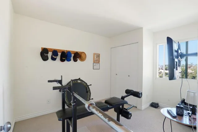 a room with furniture and gym equipment