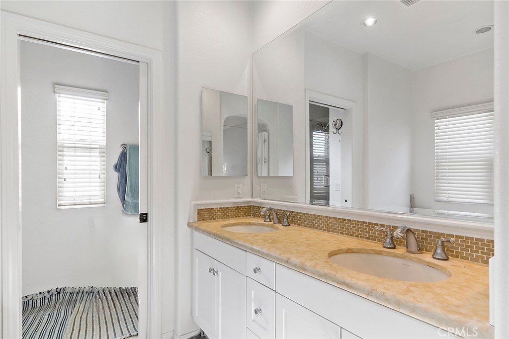 876 Sunset Place Diamond Bar, CA 91765 - Photo 11 of 17 a bathroom with a granite countertop sink and a mirror