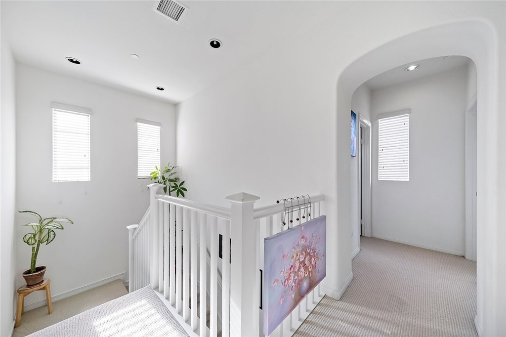 876 Sunset Place Diamond Bar, CA 91765 - Photo 7 of 17 a view of a hallway to a livingroom with wooden floor and stairs