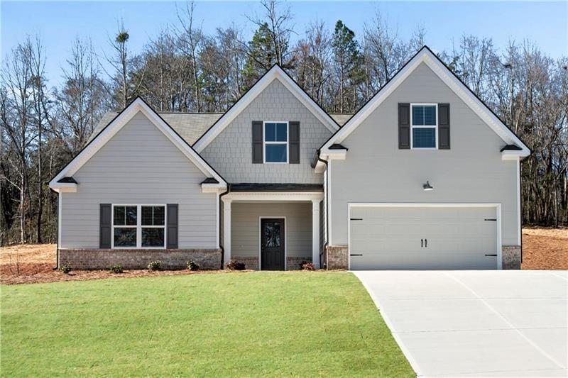 a view of a house with backyard and garden