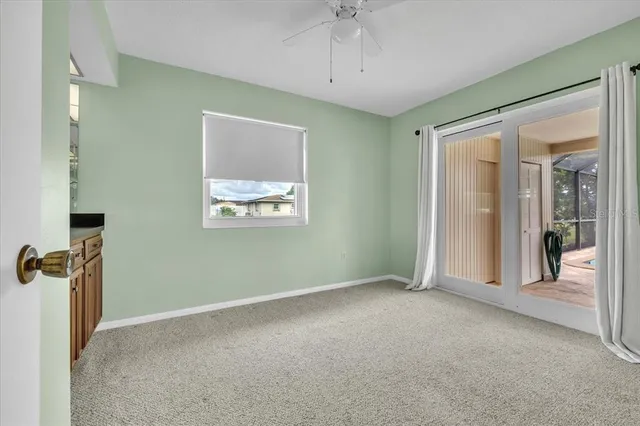 a view of hallway with granite countertop cabinets and a sink