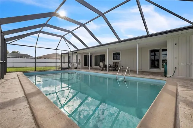 a view of a swimming pool with a patio