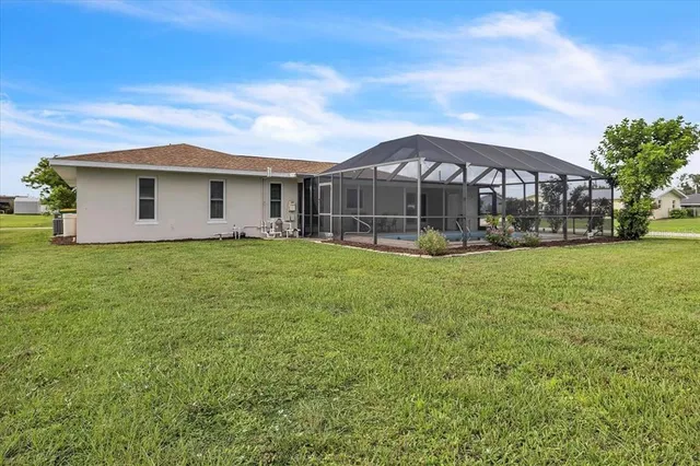 a view of a chairs and table in the garden