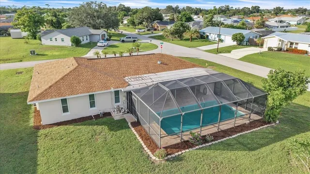 an aerial view of a house with a garden