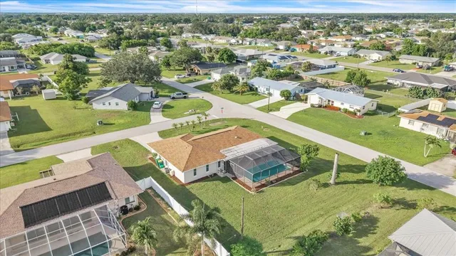 an aerial view of residential houses with outdoor space
