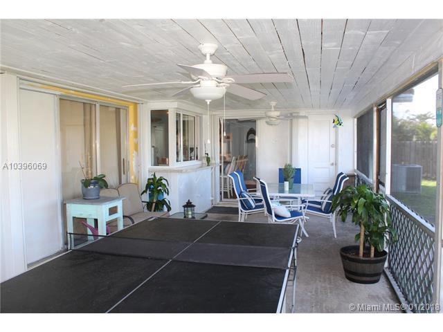 461 Northeast 42nd Street Boca Raton, FL 33431 - Photo 12 of 14 a living room with furniture a window and a potted plant