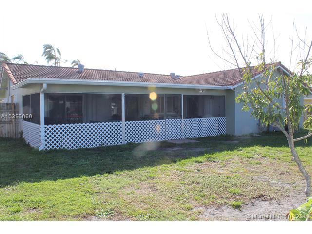461 Northeast 42nd Street Boca Raton, FL 33431 - Photo 13 of 14 a view of a house with a yard