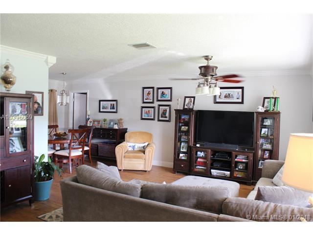 461 Northeast 42nd Street Boca Raton, FL 33431 - Photo 3 of 14 a living room with furniture and a flat screen tv