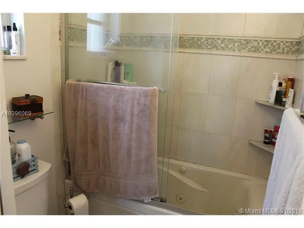 a bathroom with mirror sink and vanity