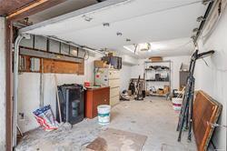86-20 57th Road Queens, NY 11373 - Photo 19 of 21 Basement with a garage