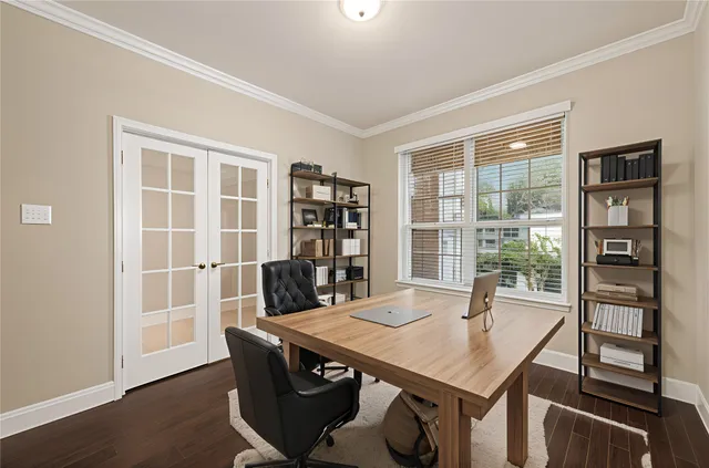 a view of a room with wooden floor and staircase