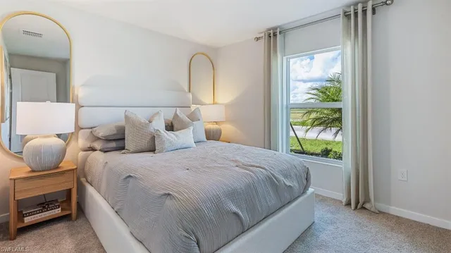 a bedroom with bed and a window