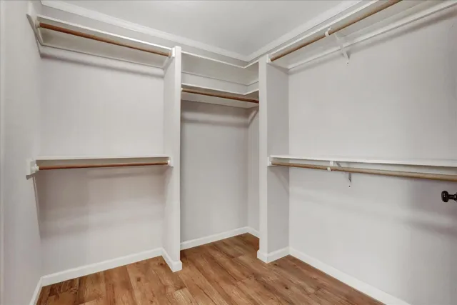 a view of room with window and cabinet