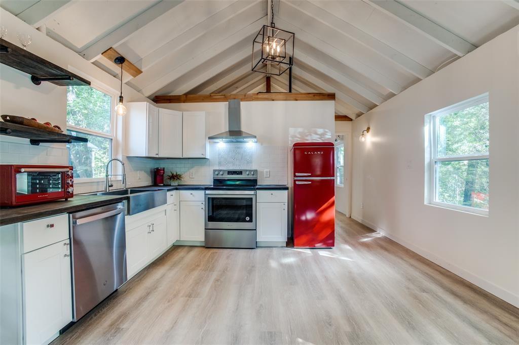 122 Allen Street Mabank, TX 75156 - Photo 4 of 10 a kitchen with stainless steel appliances granite countertop a sink a stove and refrigerator