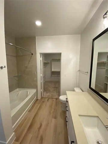 a bathroom with a bathtub and a sink