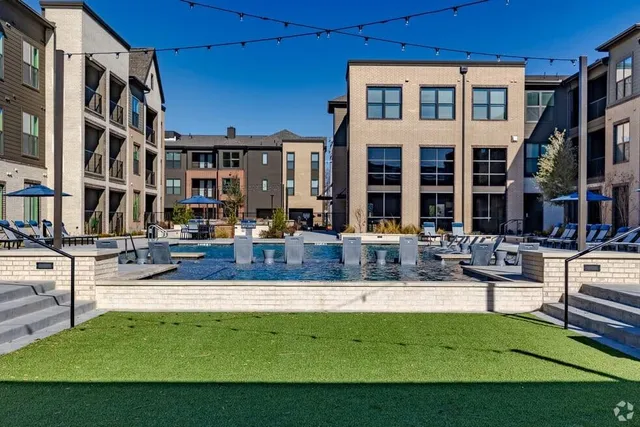 a view of pool with outdoor seating