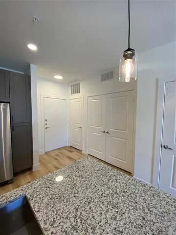 a view of a hallway to a bedroom