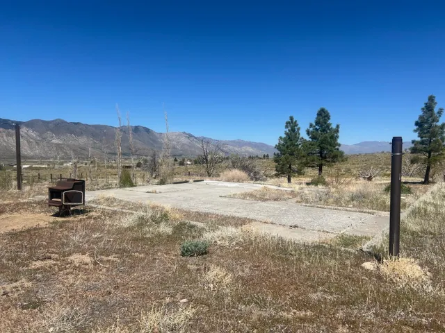 a view of a yard with a patio