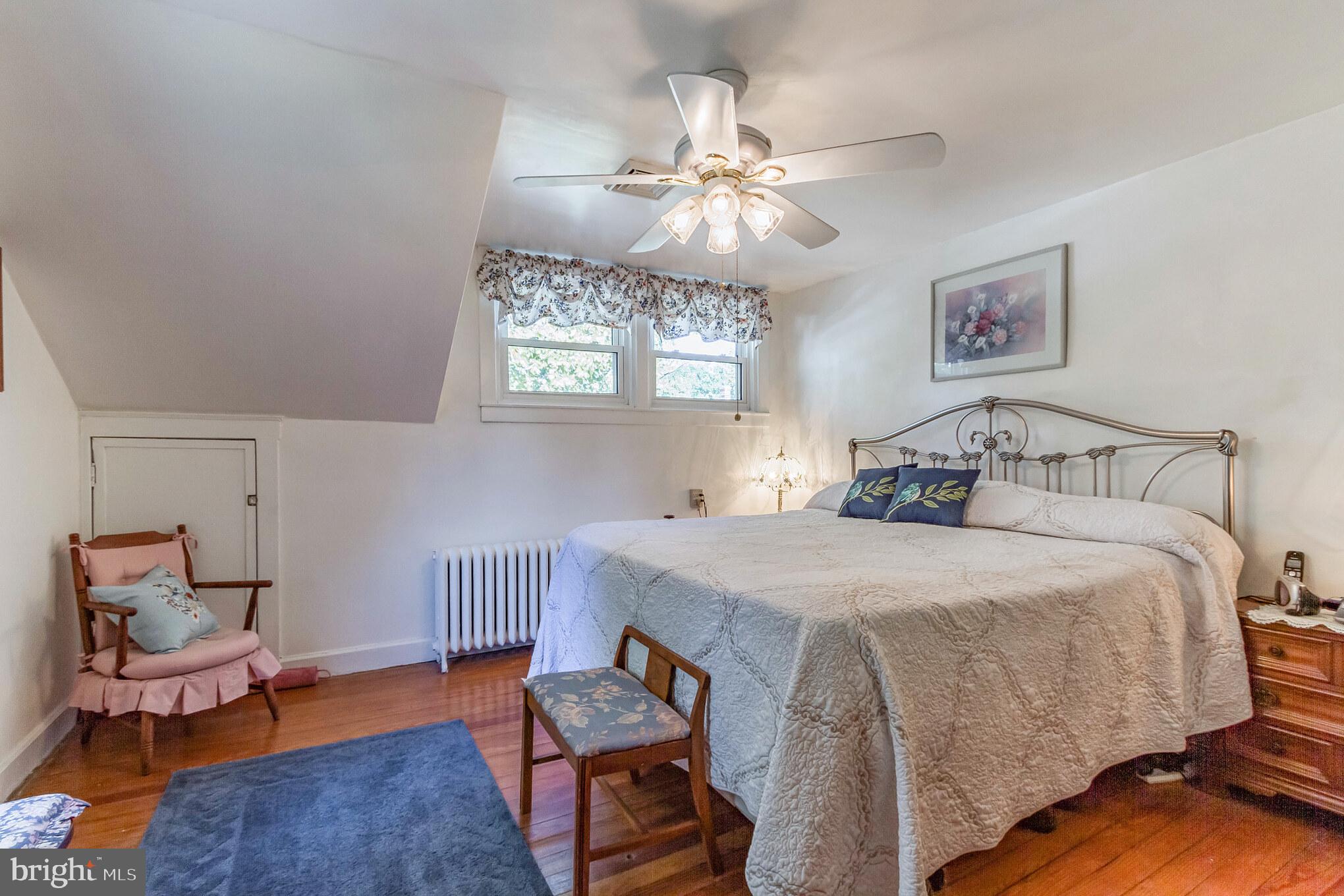 213 Garnet Street Carneys Point, NJ 08069 - Photo 13 of 39 a bedroom with a bed and wooden floor