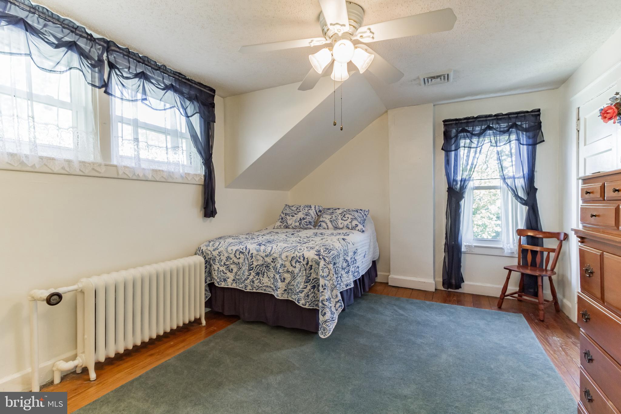 213 Garnet Street Carneys Point, NJ 08069 - Photo 15 of 39 a bedroom with a bed and a window