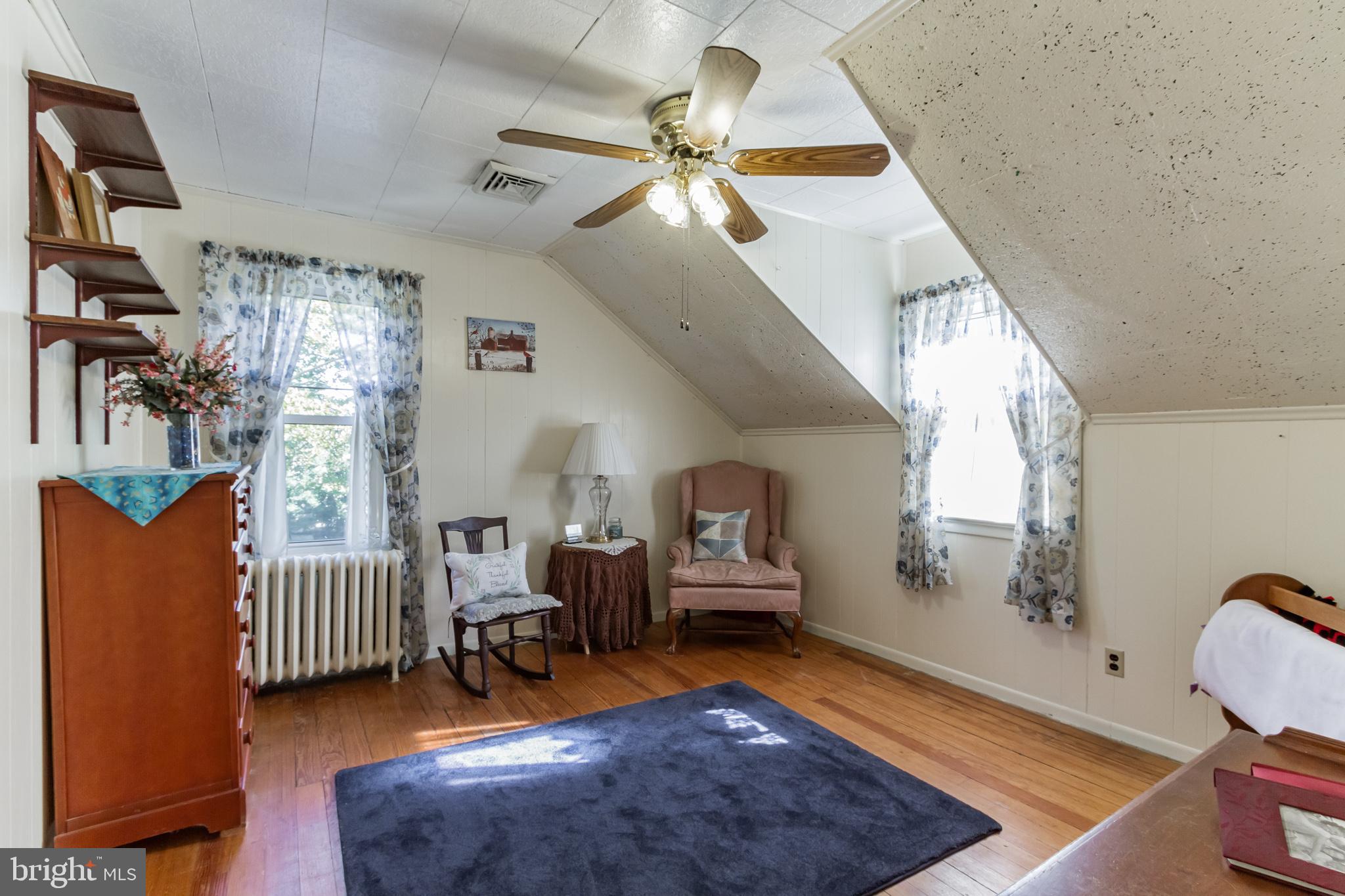 213 Garnet Street Carneys Point, NJ 08069 - Photo 17 of 39 a living room with furniture windows and a chandelier