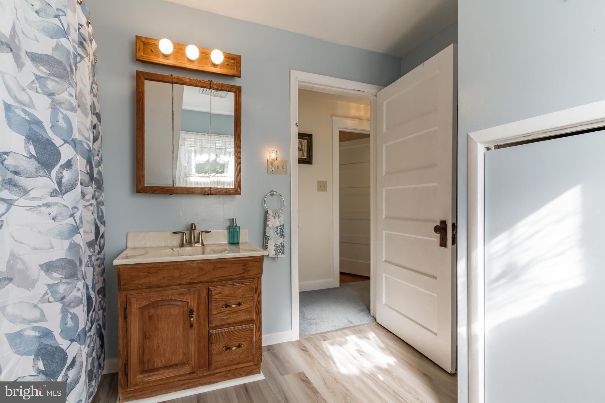 213 Garnet Street Carneys Point, NJ 08069 - Photo 19 of 39 a bathroom with a sink and a mirror