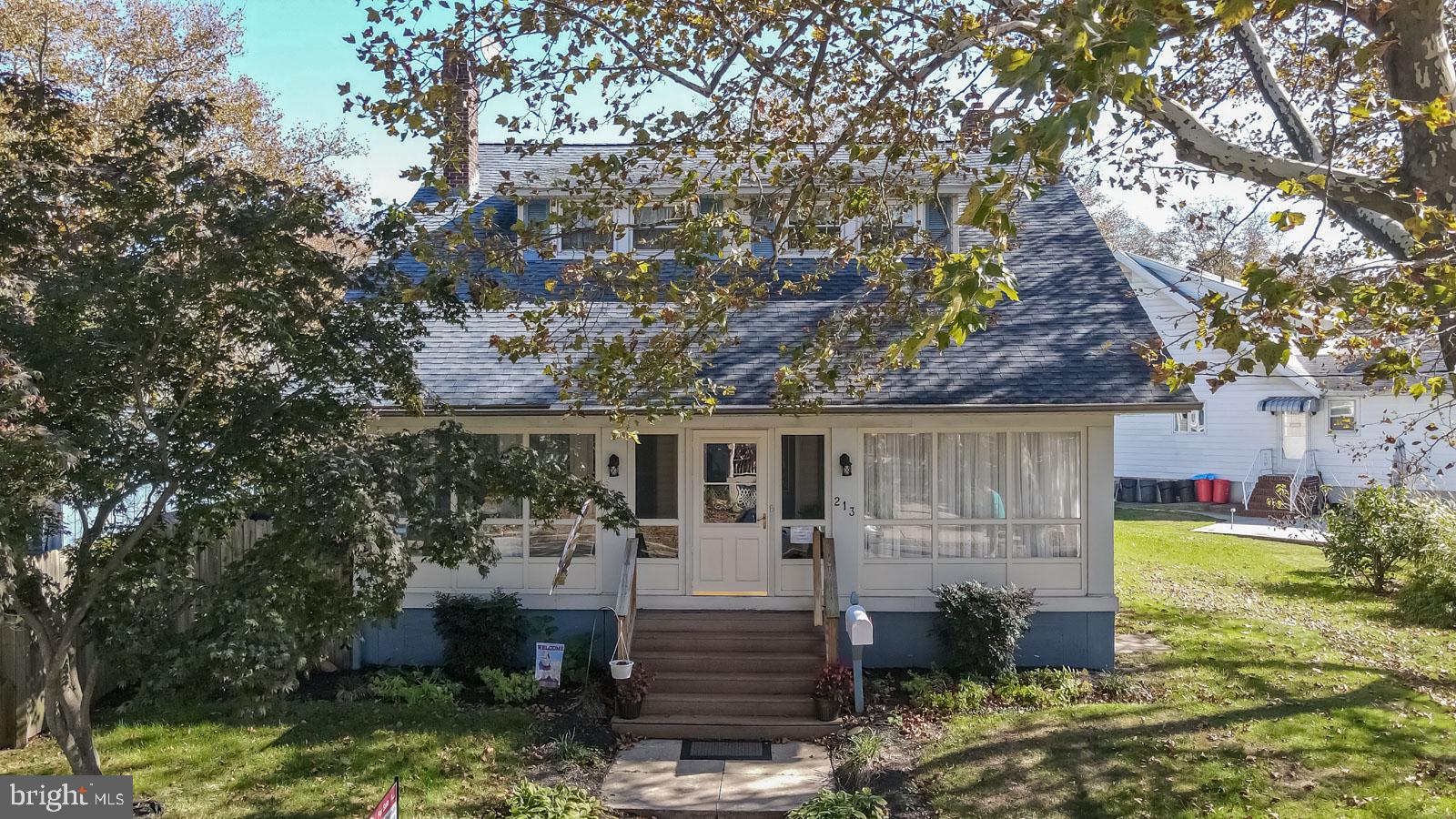 213 Garnet Street Carneys Point, NJ 08069 - Photo 29 of 39 a front view of a house with garden
