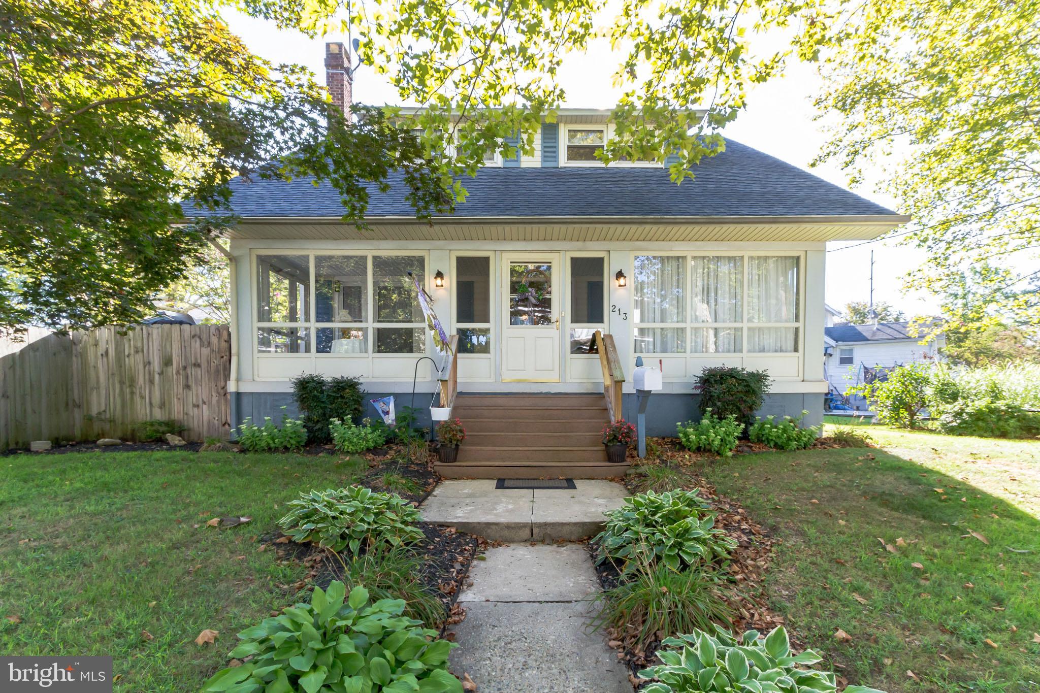 213 Garnet Street Carneys Point, NJ 08069 - Photo 5 of 39 a front view of a house with garden