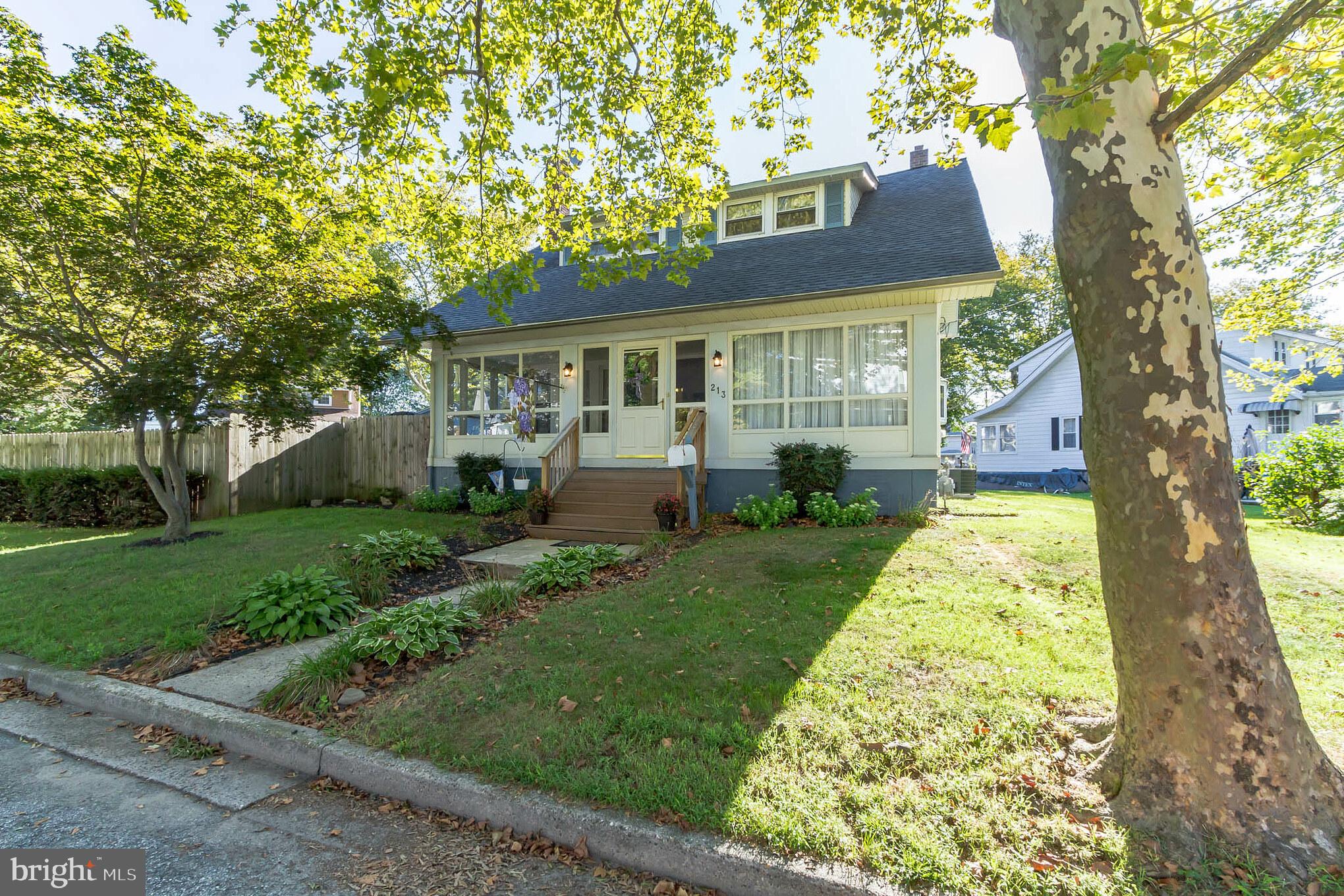 213 Garnet Street Carneys Point, NJ 08069 - Photo 6 of 39 front view of a house with a yard