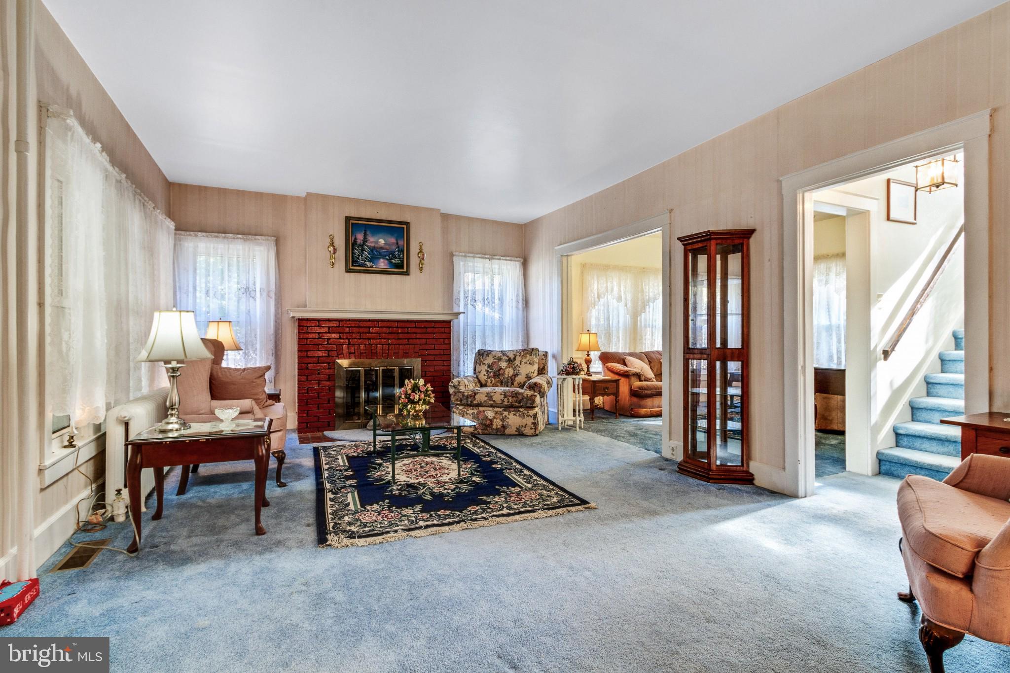213 Garnet Street Carneys Point, NJ 08069 - Photo 7 of 39 a living room with furniture and a fireplace