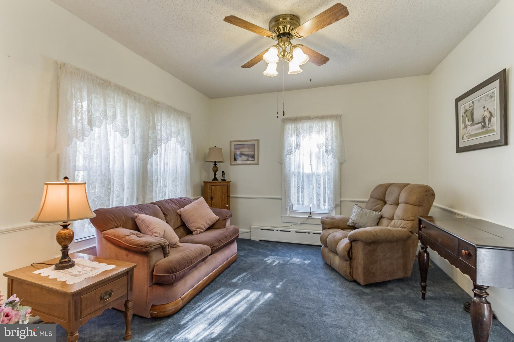 213 Garnet Street Carneys Point, NJ 08069 - Photo 8 of 39 a living room with furniture and a window