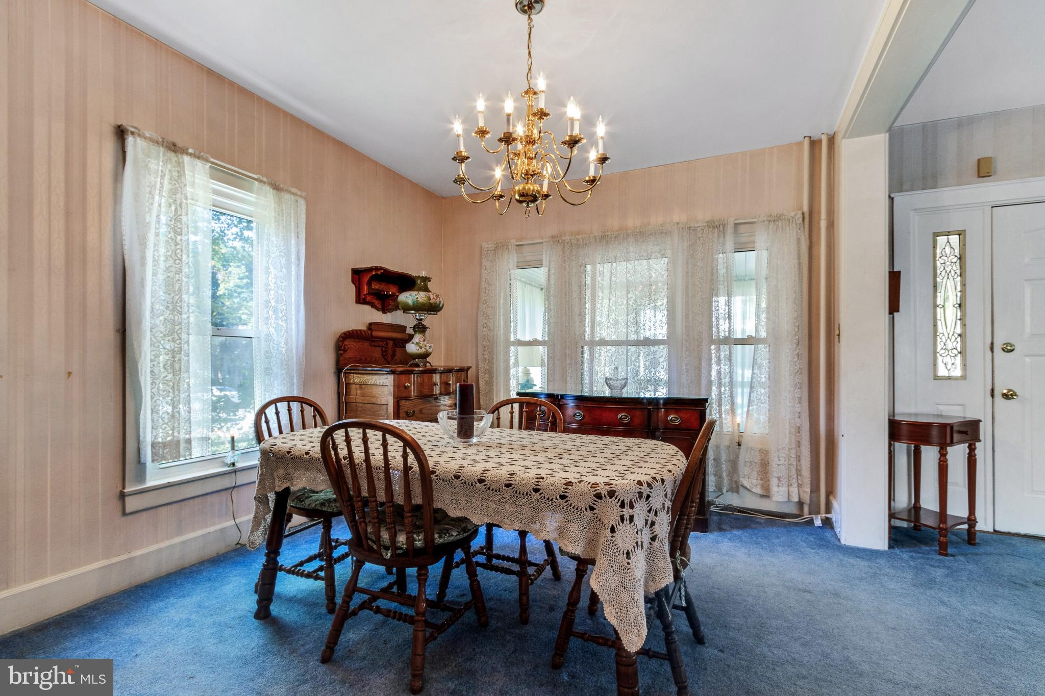 213 Garnet Street Carneys Point, NJ 08069 - Photo 10 of 39 a view of a dining room with furniture window and wooden floor