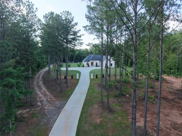 a large kitchen with a table and chairs