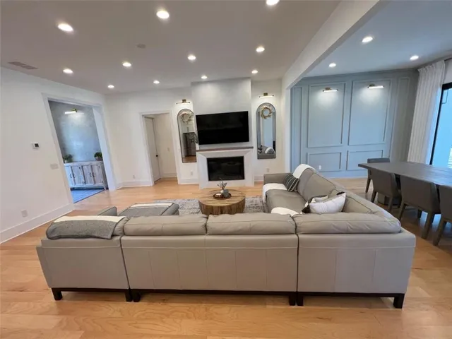 a bedroom with a bed and a large mirror